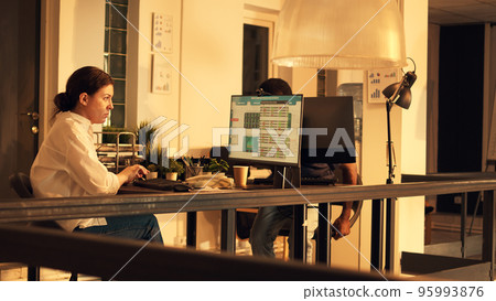 Company employee working with stock market statistics, looking at real time global exchange trend. Analyzing hedge fund index to make investment with capital money, computer data. Company employee working with stock market statistics, looking at real time global exchange trend. Analyzing hedge fund index to make investment with capital money, computer data. 95993876