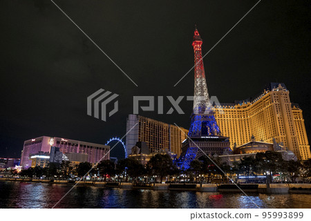 Las Vegas, USA. September 16, 2022. Illuminated Replica of Eiffel tower and Paris Las Vegas Hotel at promenade. View of luxurious casinos in Las Vegas city with dark sky in background during night. 95993899