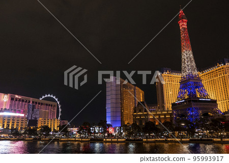 Las Vegas, USA. September 16, 2022. Replica of illuminated Eiffel tower and luxurious hotels at promenade. View of beautiful Las Vegas city with dark sky in background at night. Las Vegas, USA. September 16, 2022. Replica of illuminated Eiffel tower and luxurious hotels at promenade. View of beautiful Las Vegas city with dark sky in background at night. 95993917