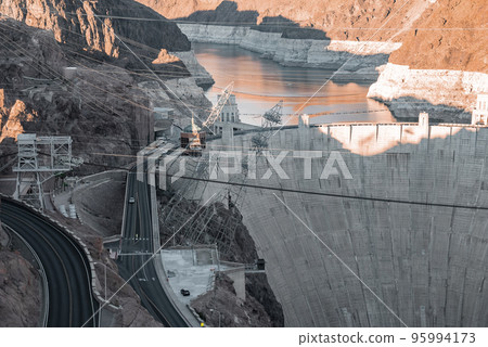 Aerial View Of Cables Over Arch Bridge And Hoover Dam Amidst Mountain At Nevada Aerial View Of Cables Over Arch Bridge And Hoover Dam Amidst Mountain At Nevada 95994173