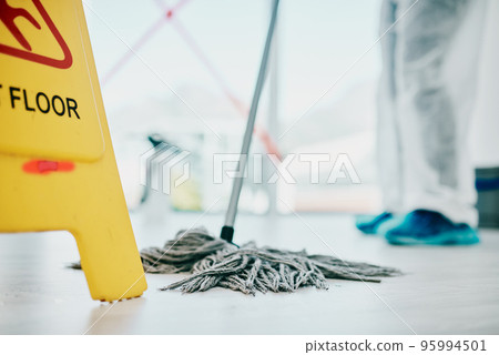 As clean as floors should be. Shot of a healthcare worker a wearing hazmat suit and sanitising a room during an outbreak. As clean as floors should be. Shot of a healthcare worker a wearing hazmat suit and sanitising a room during an outbreak. 95994501