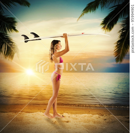 Surfer girl in a tropical beach 95994901