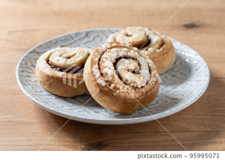Cinnamon rolls buns on wooden table with copy space. Kanelbulle Swedish dessert 95995071