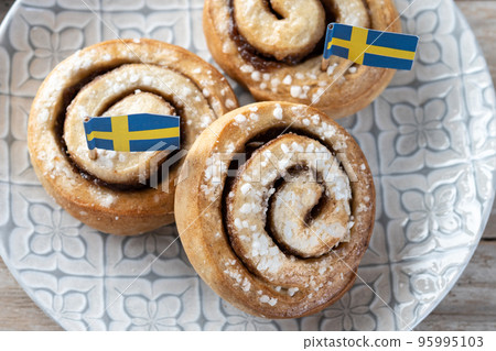 Cinnamon rolls buns on wooden table with copy space. Kanelbulle Swedish dessert 95995103