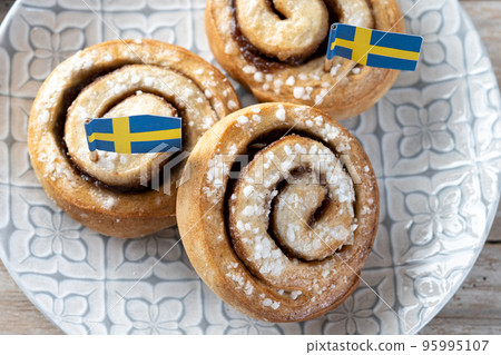 Cinnamon rolls buns on wooden table with copy space. Kanelbulle Swedish dessert 95995107