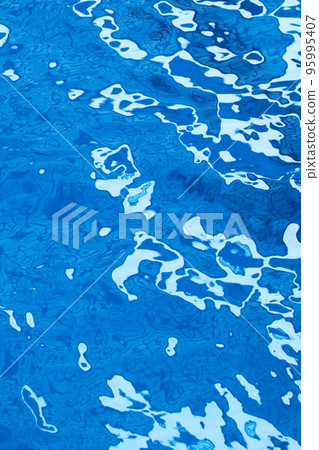 Blue water surface texture of large outdoor pool with beautiful natural wave pattern. Blue water surface texture of large outdoor pool with beautiful natural wave pattern. 95995407