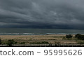 grey overcast sky over sea waves 95995626