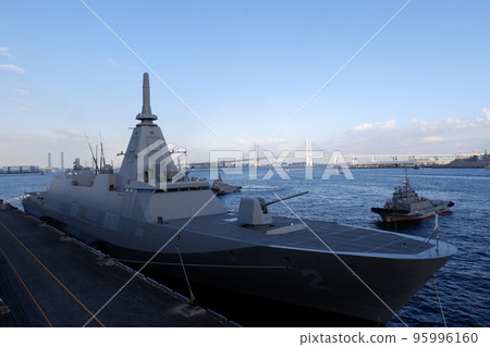 Escort ship Kumano departing from port 95996160