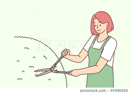 Female gardener cutting bushes Female gardener cutting bushes 95996898