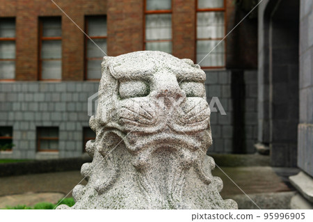 head of traditional Japanese statue of a stone lion at the entrance to the Sakhalin Museum of Local Lore head of traditional Japanese statue of a stone lion at the entrance to the Sakhalin Museum of Local Lore 95996905