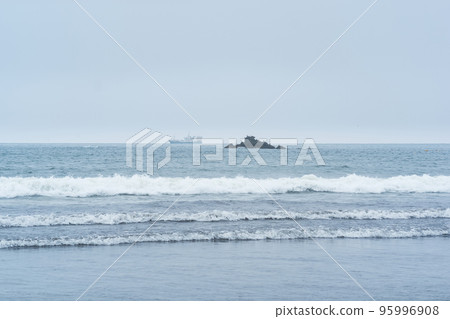 landscape with a sea rock and a sailing ship in the distance 95996908