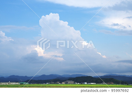 Sunny autumn sky with thunderheads and field scenery Sunny autumn sky with thunderheads and field scenery 95997692