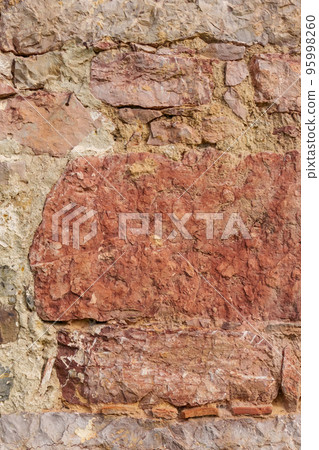 Grungy stone wall of an abandoned building background Grungy stone wall of an abandoned building background 95998260