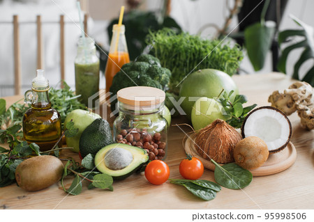Balanced diet, cooking, culinary and food concept - close up of vegetables, fruit on wooden table. 95998506