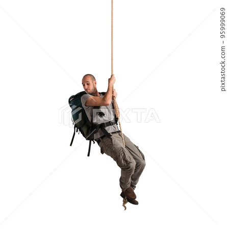 Explorer hanging from a rope 95999069