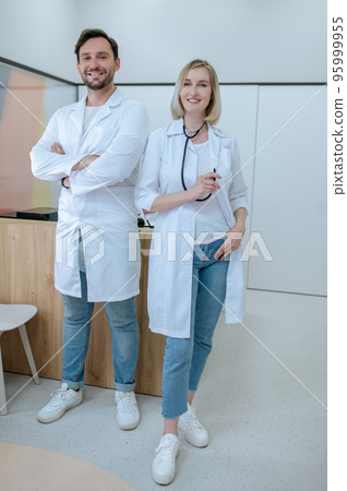 Two doctors in lab coats in the clinic 95999955