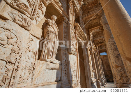 A statue in Celsus library in ancient city of Ephesus or Efes in Turkey. Antique ruins of roman city A statue in Celsus library in ancient city of Ephesus or Efes in Turkey. Antique ruins of roman city 96001551