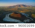 Aerial landscape of Meke Crater in Turkey. Stunned view of green valley with mountains and crater lake at sunset 96001699