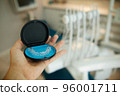 Two invisible dental aligners in the personal box. Orthodontic plastic transparent braces for teeth straightening  96001711