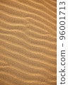 A beautiful sand texture. A wavy desert background. A sand dune backdrop 96001713