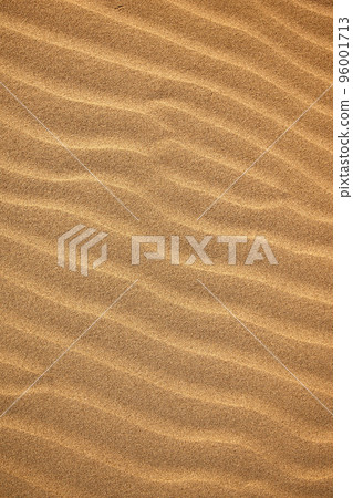 A beautiful sand texture. A wavy desert background. A sand dune backdrop A beautiful sand texture. A wavy desert background. A sand dune backdrop 96001713