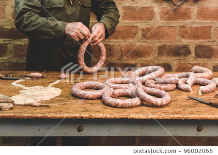Hands making homemade sausages, Patagonia, Argentina Hands making homemade sausages, Patagonia, Argentina 96002068