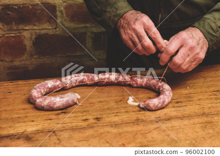 Hands making homemade sausages, Patagonia, Argentina Hands making homemade sausages, Patagonia, Argentina 96002100