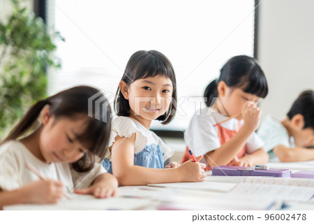 Elementary school students studying at cram school. Elementary school students studying at cram school. 96002478