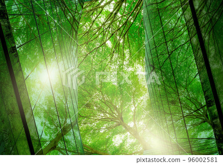 Sustainble green building. Eco-friendly building. Sustainable glass office building with tree for reducing carbon dioxide. Office with green environment. Corporate building reduce CO2. Safety glass. 96002581