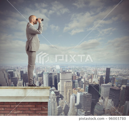 Businessman looks beyond Businessman looks beyond 96003780