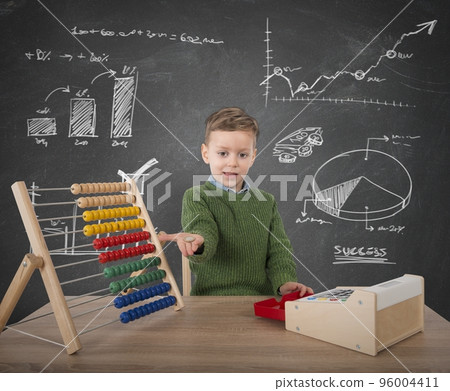 Child plays with money 96004411