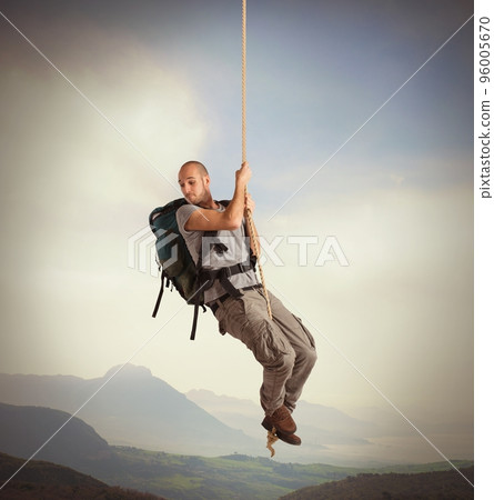 Explorer hanging from a rope Explorer hanging from a rope 96005670