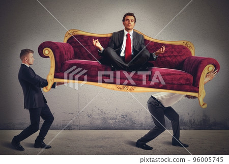 Men carrying a yoga businessman on sofa 96005745