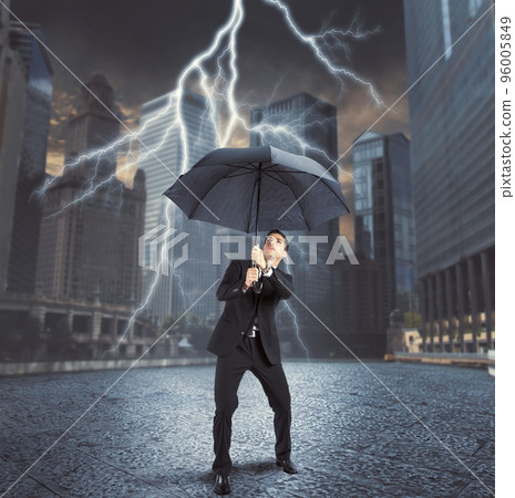 Businessman against lightning 96005849
