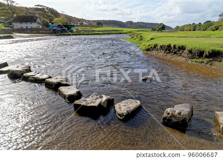 Old stepping stones to cross Ewenny River at Ogmore Castle Old stepping stones to cross Ewenny River at Ogmore Castle 96006687