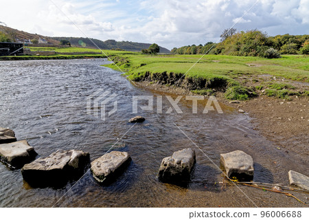 Old stepping stones to cross Ewenny River at Ogmore Castle Old stepping stones to cross Ewenny River at Ogmore Castle 96006688