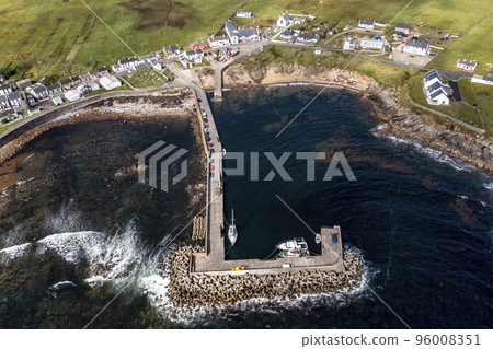 Aerial view of the settlement An Baile Thiar or West Town on Tory Island and harbour, County Donegal, Republic of Ireland 96008351