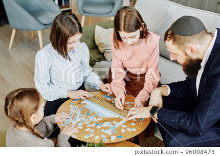 Jewish Family Doing Puzzles Jewish Family Doing Puzzles 96008473
