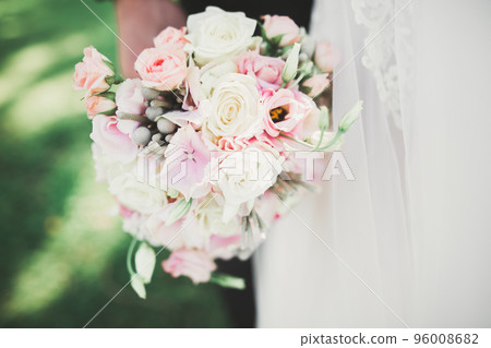 Beautiful wedding bouquet with different flowers, roses 96008682