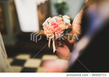 Wedding couple bide and groom get married in a church Wedding couple bide and groom get married in a church 96008733