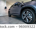 charging station of a modern electric car. The side of the electric crossover. Type 2 Euro connector 96009322