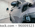 Charging station of a modern electric car. The back of the electric crossover. 96009323