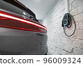 Charging station of a modern electric car. The back of the electric crossover. 96009324
