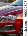 Headlights and fog lights of the red car.  vertical 96009325