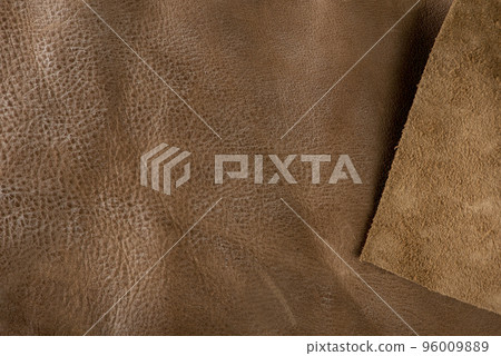 Texture of brown leather. Texture of natural brown leather. Background for design or project Texture of brown leather. Texture of natural brown leather. Background for design or project 96009889