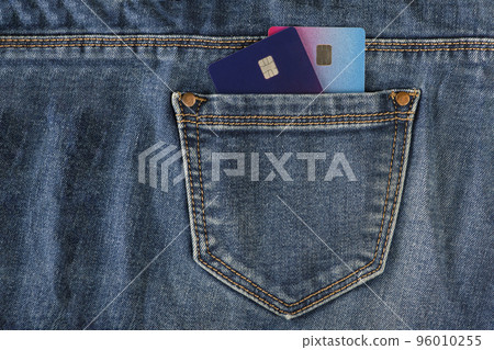 Credit cards in your pocket. Credit cards in the pocket of blue jeans. The concept of purchases and expenses, unplanned expenses. Credit cards in your pocket. Credit cards in the pocket of blue jeans. The concept of purchases and expenses, unplanned expenses. 96010255