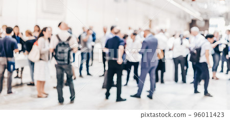 Abstract blurred people socializing during coffee break at business meeting or conference. Abstract blurred people socializing during coffee break at business meeting or conference. 96011423