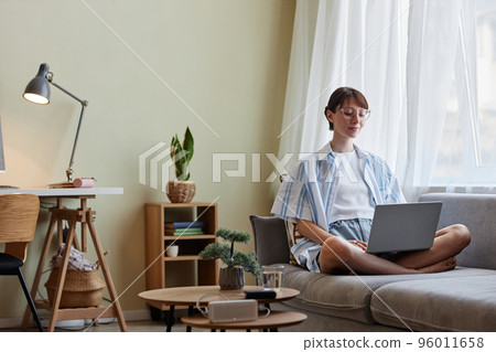 Young woman enjoying weekend at home 96011658