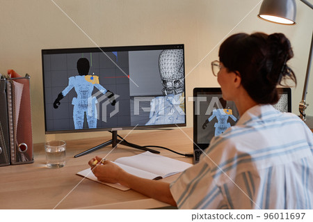 Female designer building digital 3D models 96011697