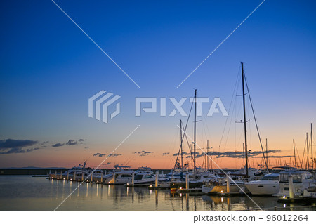 Yacht harbor with beautiful magic hour in the background 96012264